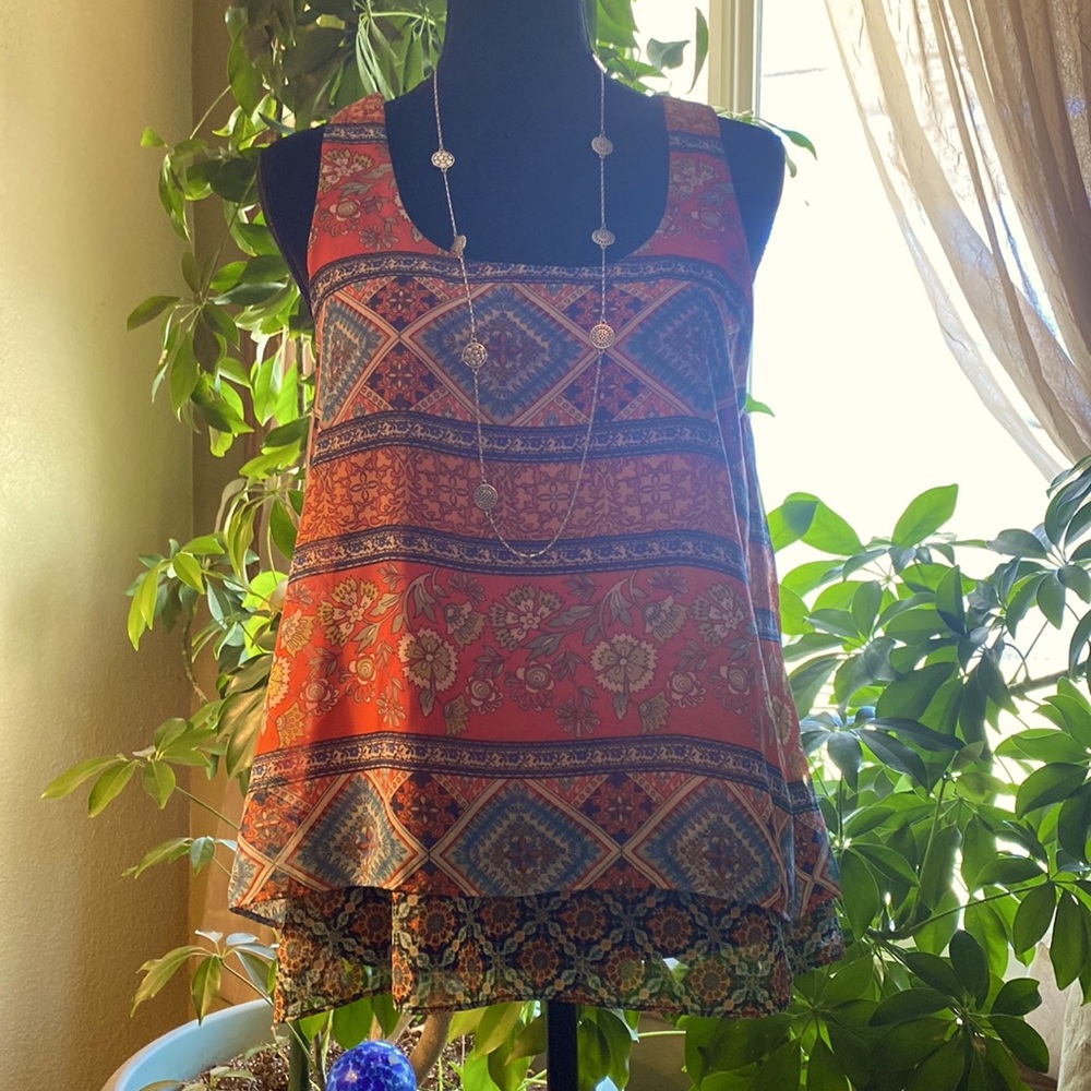 Super cute, soft, multi colors sleeveless summer blouse.